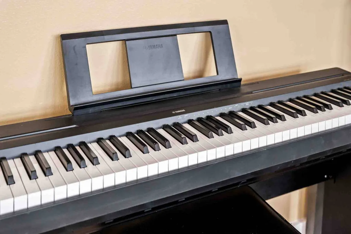 A close-up interior shot of a keyboard with piano keys and a music stand, inviting guests to play music, practice, or compose their own tunes. The inspirational mood suggests opportunities for creative relaxation and musical enjoyment during evenings at the home.